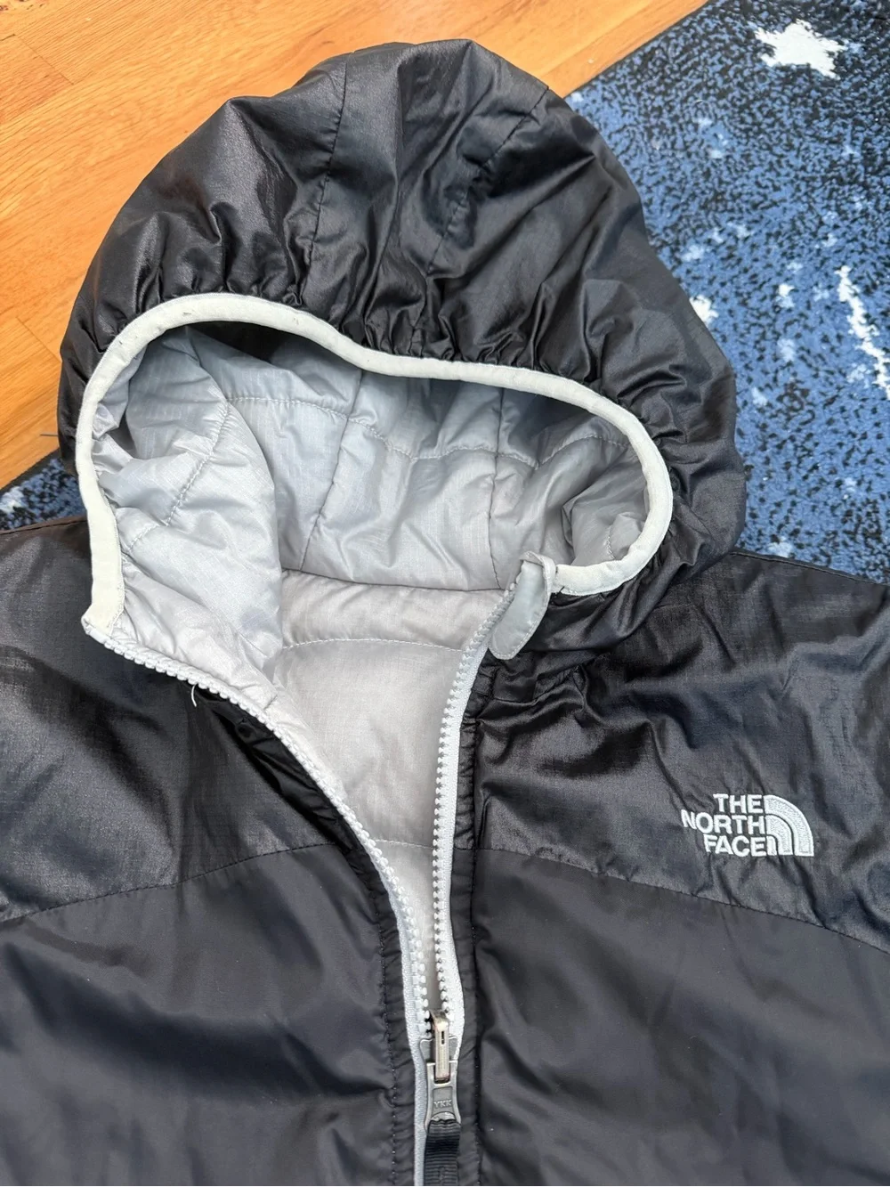 The North Face Kids Black Hooded Puffer Jacket with Light Gray Trim